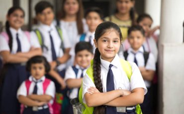 Group of Indian schoolboys and schoolgirls at school campus